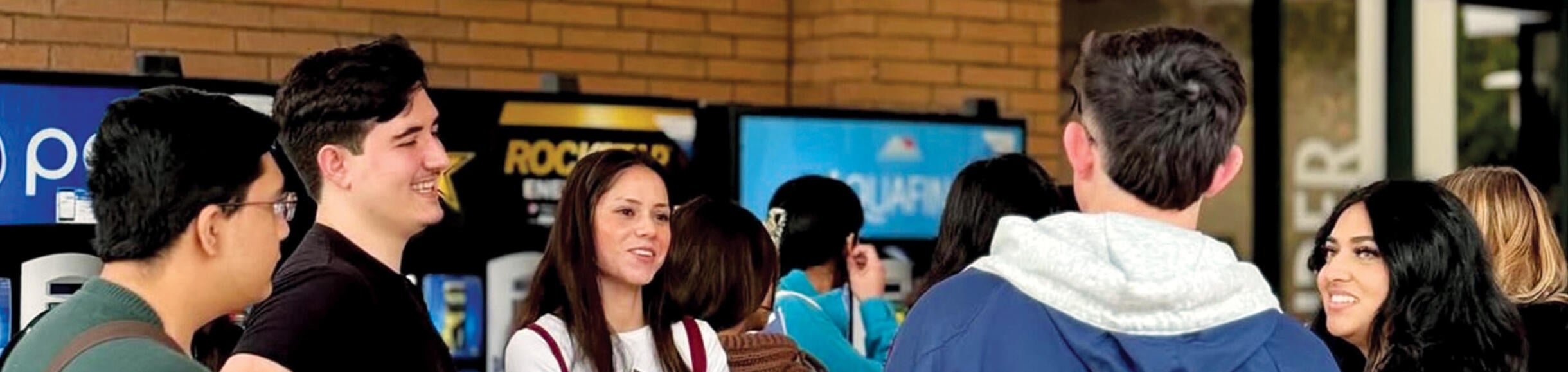 Students chatting during Highlander Orientation for Transfers near UCR Bookstore